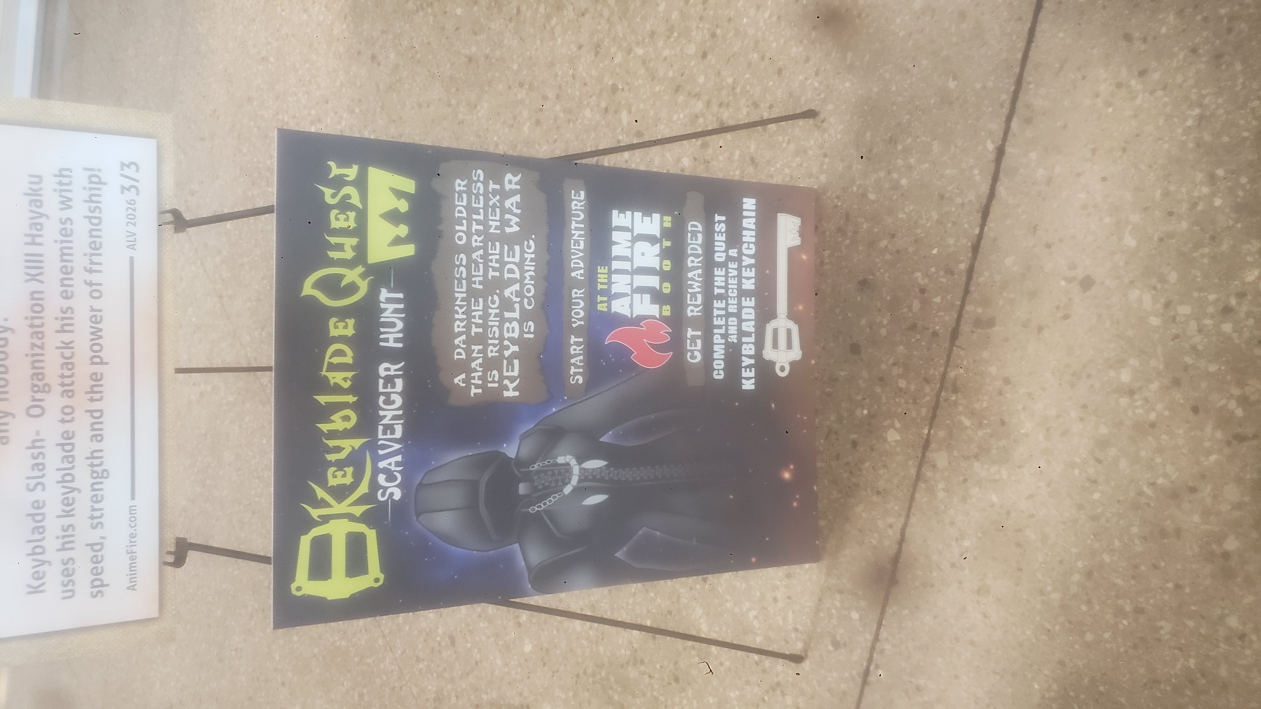 Sign talking about the keyblade quest scavenger hunt at a con.